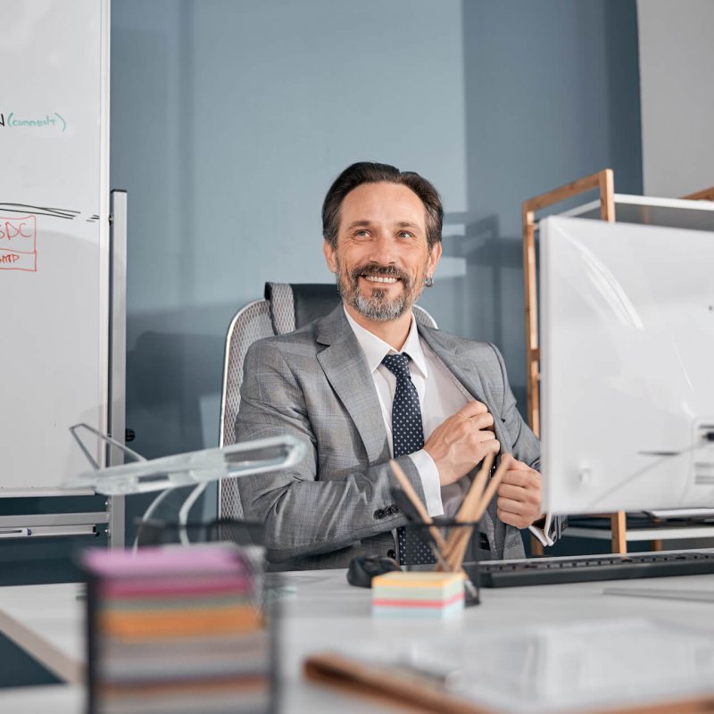 cheerful-businessman-in-gray-suit-working-in-moder-2021-09-03-14-19-38-utc.jpg